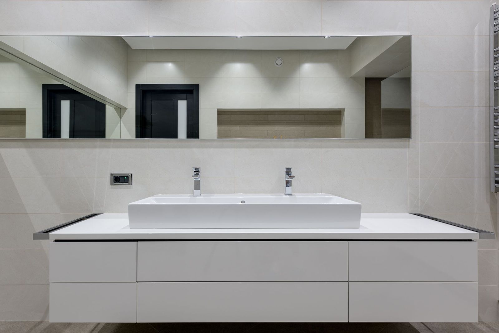 Bathroom refurbishment: pressure, waste falls and the position of the soil pipe decide the layout long before anybody chooses tiles.