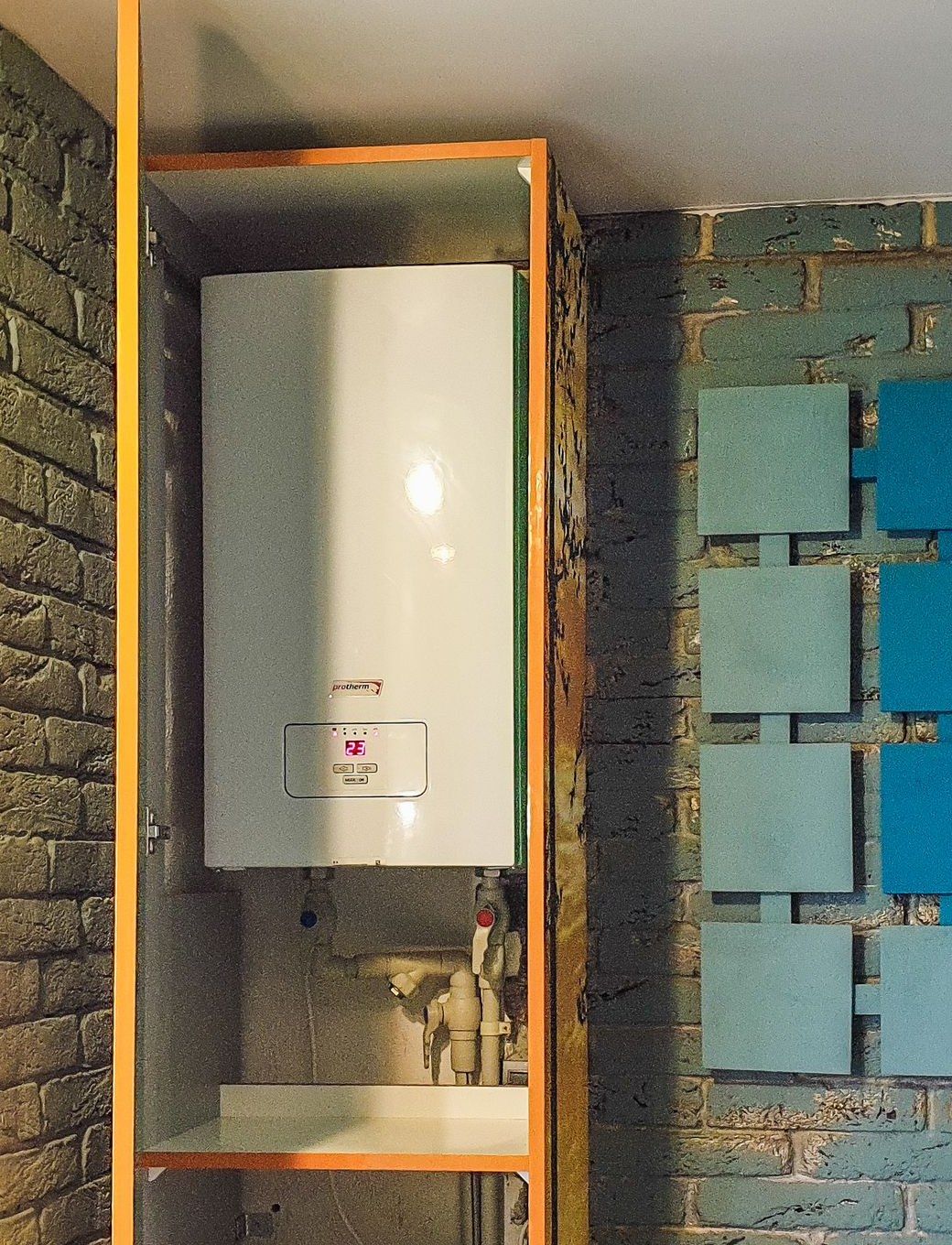 A wall-mounted gas boiler with its controls visible